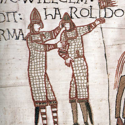 William of Normandy helping to straighten Harold’s head and presenting him with a new arm.
